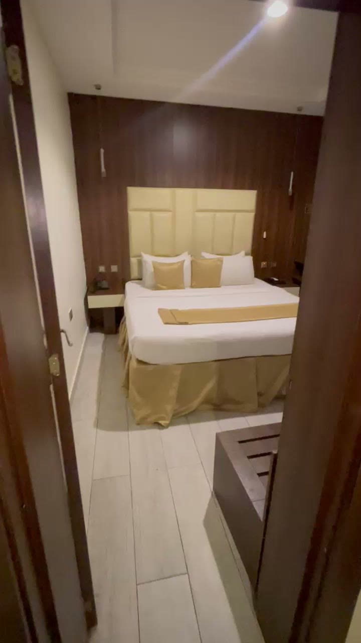 The suite bedroom seen through its open door